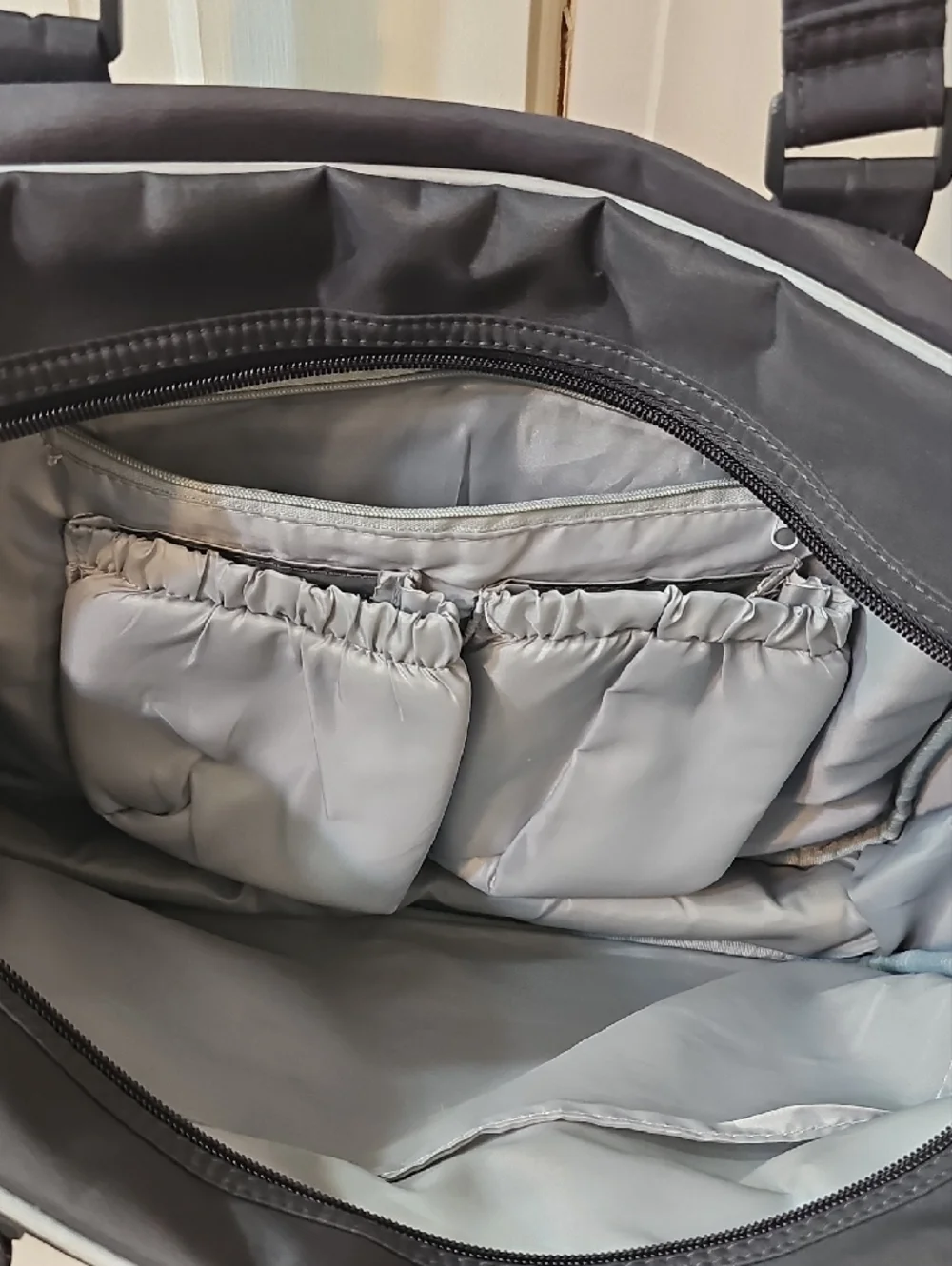 Eddie Bauer Black Quilted Baby Bag with White Piping